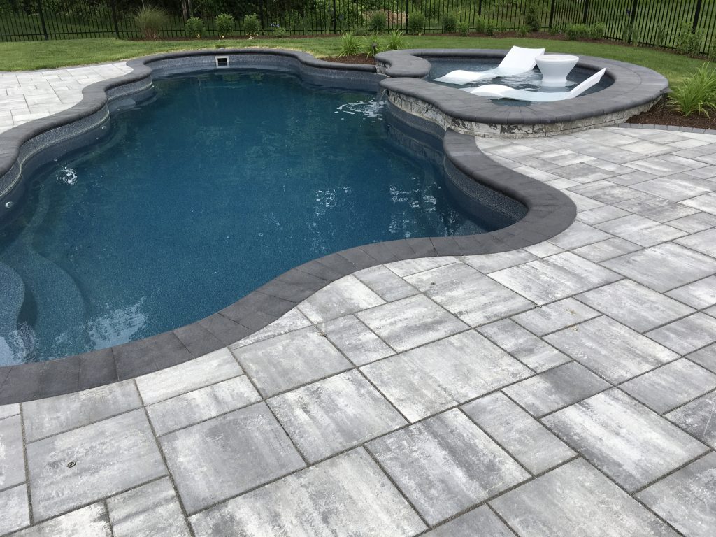 does fiberglass pool last as long as gunite RI